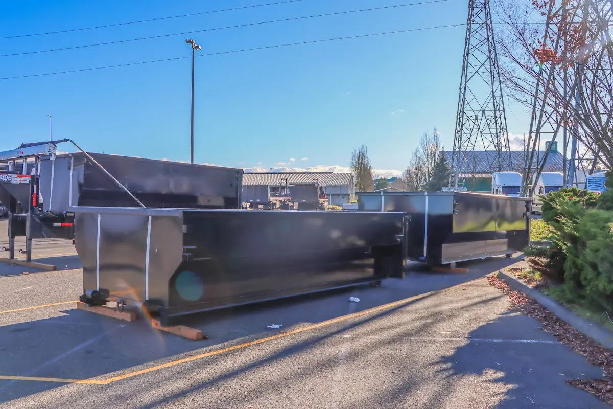 Roll-off dumpster ready for waste disposal at job site for Concrete Dumpster Rental in Derry
